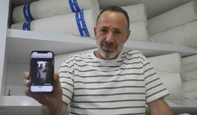 İş yerine giren 2 metrelik yılana “kanka” diye hitap edip boynuna doladı