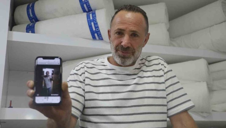 İş yerine giren 2 metrelik yılana “kanka” diye hitap edip boynuna doladı